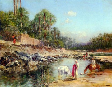 アラブ Painting - キャラバンのそばに立つ人物 ヴィクトル・ユゲ・アラベール